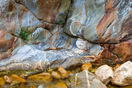 Color and shapes of the rock eroded by the passage of water. Truchillas River, Sierra de la Cabrera, León, Spain.