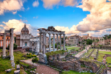Fototapeta na wymiar Forum Romanum Illuminated by Colorful Sunset with Bright Clouds, Rome