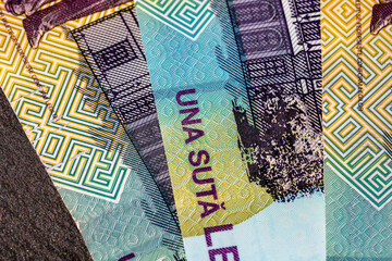 Selective focus on detail of lei banknotes. Close up macro detail of romanian lei banknotes, 100 lei isolated. World money concept, inflation and economy concept