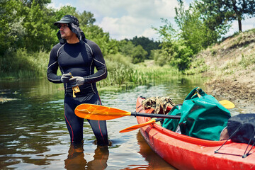 Happy best friends having fun on a kayaks. Kayaking on the river.