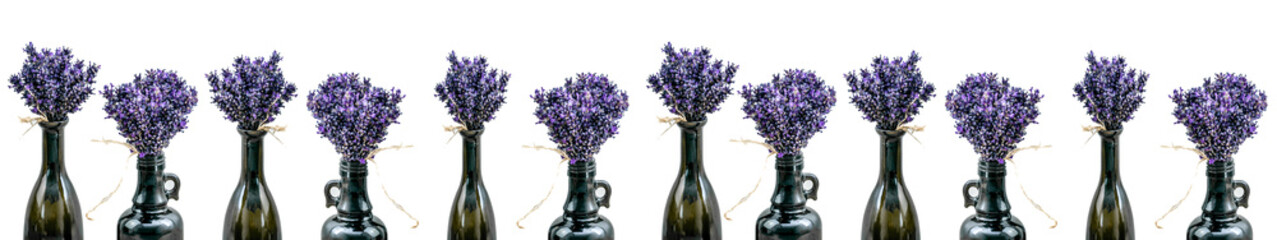 Many bouquet of violet purple lavandula lavender flowers herbs in old brown vases (pharmacy bottle), isolated on white background banner panoramic panorama long, close up