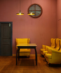 Bright interior room with a sofa and armchairs