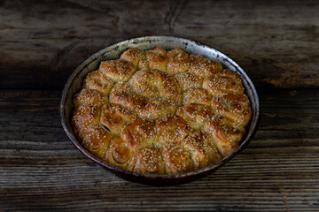 Homemade baked bread on rustic wooden background