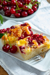 Fresh baked cake with red ripe juicy sour cherry or kriek berry