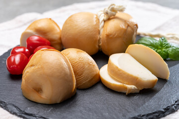 Italian semi hard handmade smoked scamorza cheese, from cow milk from Apulia or Calabria regions