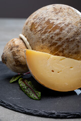 Italian semi hard matured caciocavallo cheese, handmade and aged in natural underground caves in...