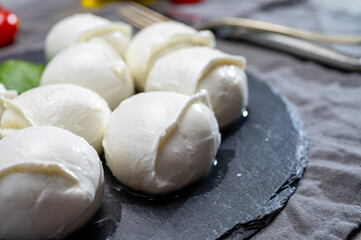 Tasty italian food, fresh white buffalo mozzarella soft cheese balls from Campania