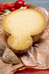 Italian semi hard matured caciocavallo cheese, handmade and aged in natural underground caves in...