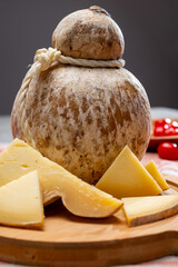 Italian semi hard matured caciocavallo cheese, handmade and aged in natural underground caves in...