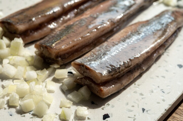 Season of new Dutch herring fresh salted fish ready to eat, traditional food in Netherlands