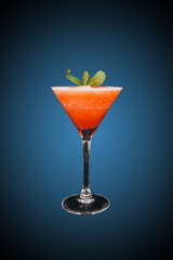 Frozen strawberry cocktail isolated on blue gradient