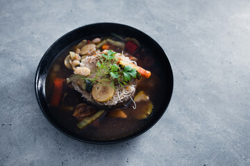 plant-based food, vegan noodles soup with mixed stir fry vegetables