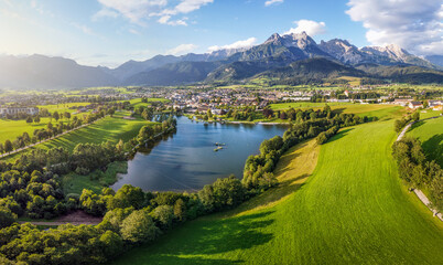 Naklejka premium Aerial view over Saalfelden with Steinernes Meer in Summer, Salzburg, Austria