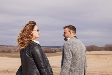 Young modern stylish couple outdoors.