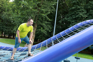 Fototapeta premium Man training over obstacle course