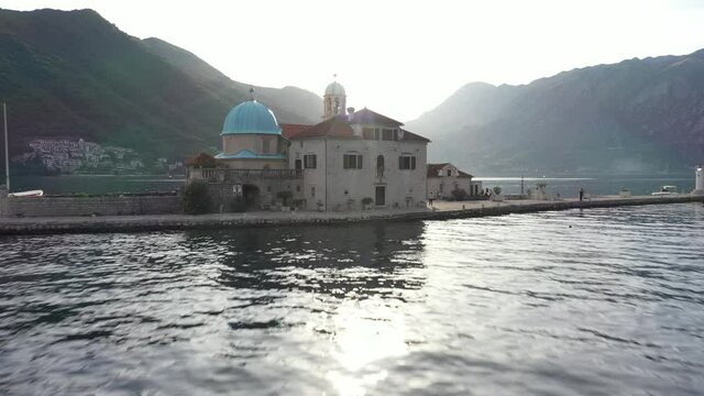 St. George and Gospa od Skrpela islands near town Perast in Montenegro. Sunset. Drone footage.