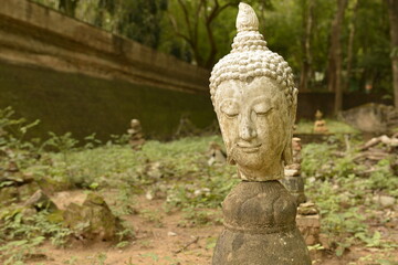 Ancient Wreckage Buddha Statue at Wat U Mong (Tunnel) Chiang Mai province, Thailand.