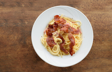 Carbonara pasta Spaghetti bacon noodle on wood top view