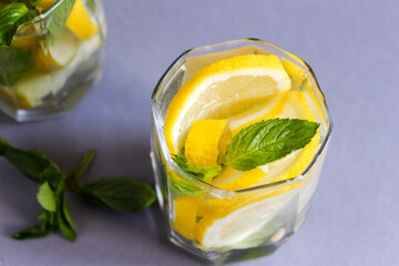 Lemonade or mojito cocktail with lemon and mint, cold refreshing drink or beverage