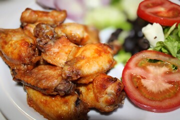 roasted chicken with salad on food table