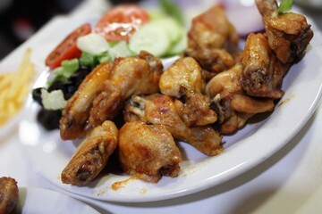 roasted chicken with salad on food table