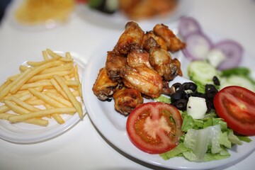 roasted chicken with salad on food table