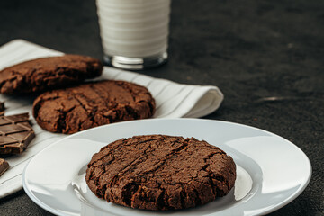 Chocolate cookies on dark table close up