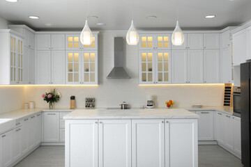 Elegant interior of new kitchen with stylish furniture