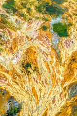 Environmental pollution from the extraction of copper ore and copper pyrite. View from above. Dead soil and forest