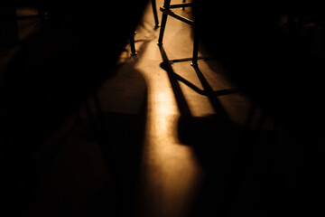 Light and shadow underneath the restaurant table