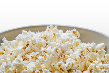 Popcorn in a bowl on white background