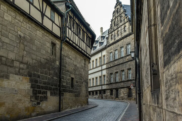 Narrow medieval street with traditional Bavarian houses in Bamberg, Bavaria, Franconia, Germany. November 2014