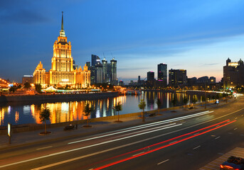 Fototapeta na wymiar Krasnopresnenskaya embankment on Moskva river. Summer evening.