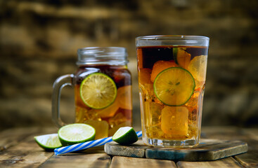 iced tea cocktail with strong drinks, wood background