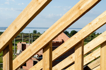 wooden frame of beams for the roof of the house. construction of houses