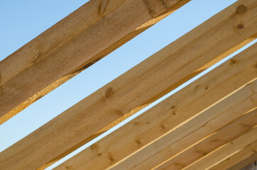 wooden bars against the sky. roof construction