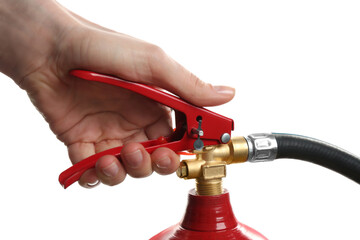 Woman using fire extinguisher on white background, closeup