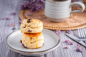 Traditional British scones with a tea cup and blurred background