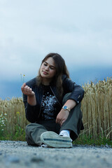 Alternative lifestyle of a woman on the meadow.