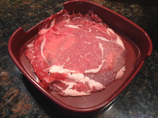 Raw beef sliced pieces on  dish