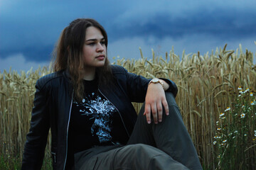 Alternative lifestyle of a woman on the meadow.