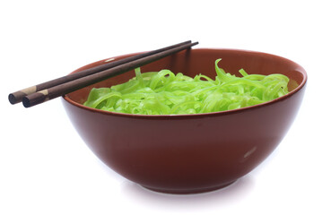 green noodles on bowl isolated on white background