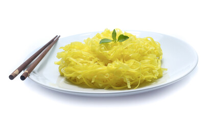 yellow noodles on dish isolated on white background