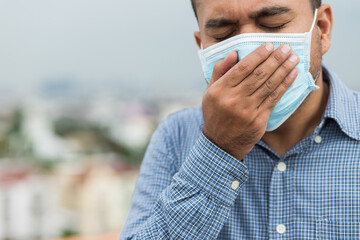 Close up young asian man wearing protection face mask against coronavirus.