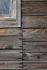wall of an old destroyed wooden house, gray wood texture