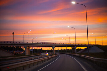 motorway in the evening with beautiful sky and sunset lighting