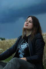 Alternative lifestyle of a woman on the meadow.