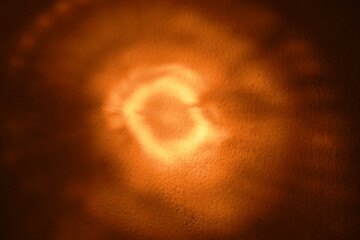  flashlight spreading beam on home wall in dark night