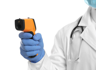 Doctor in latex gloves holding non contact infrared thermometer on white background, closeup....