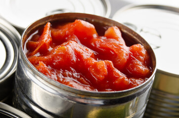 Canned sliced tomatoes in just opened tin can. Non-perishable food